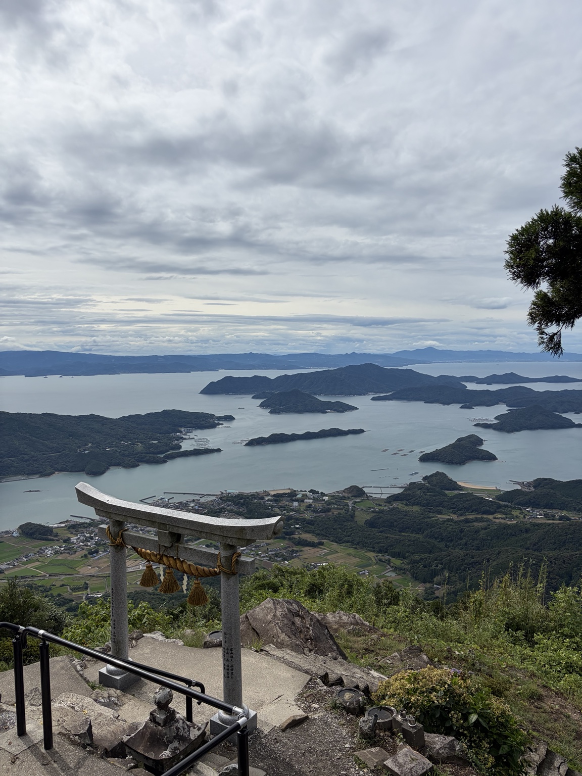 NOVIPPON photograph of a torii overlooking the sea and islands of Kyushu